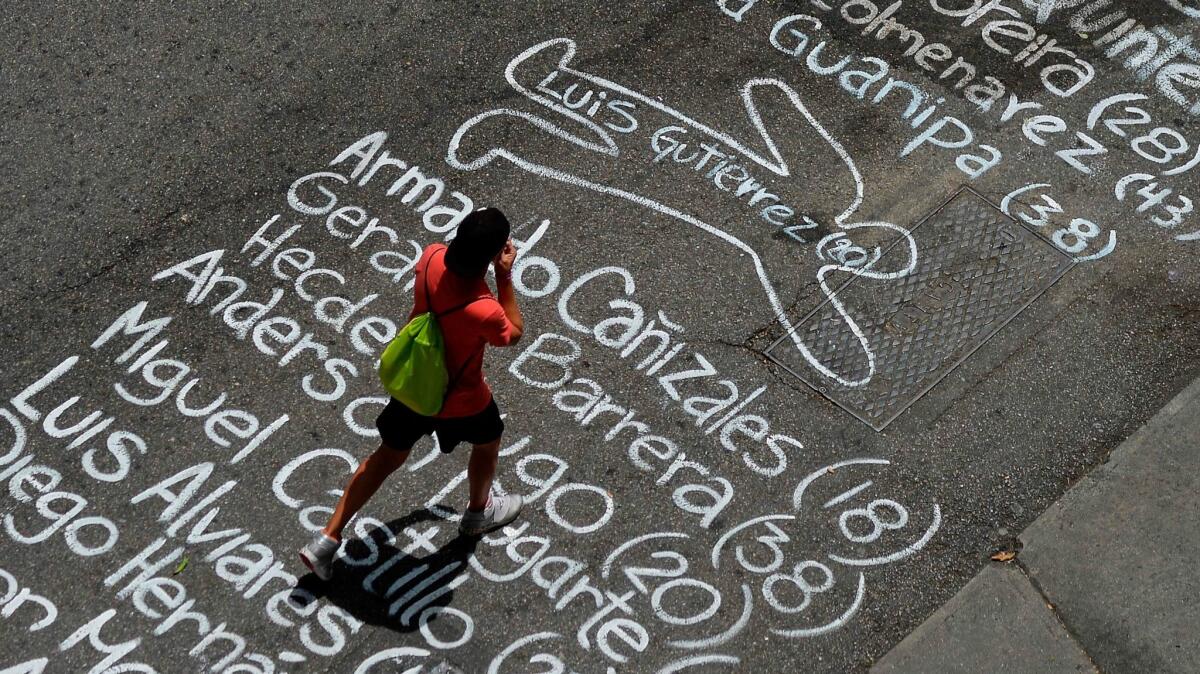 A street in eastern Caracas is covered with the names of people killed during more than two months of protests against President Nicolas Maduro's government.