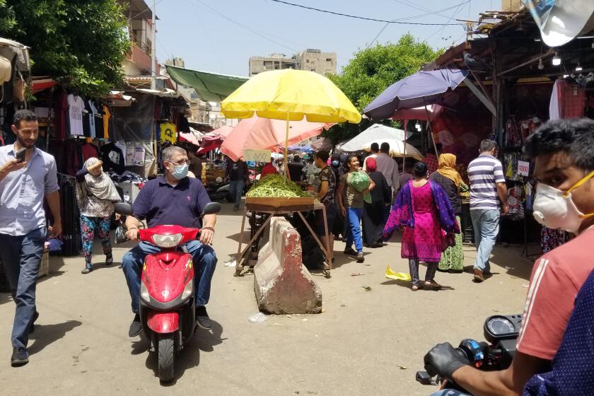 The open-air market in Sabra street is perpetually chaotic, even in times of social distancing.