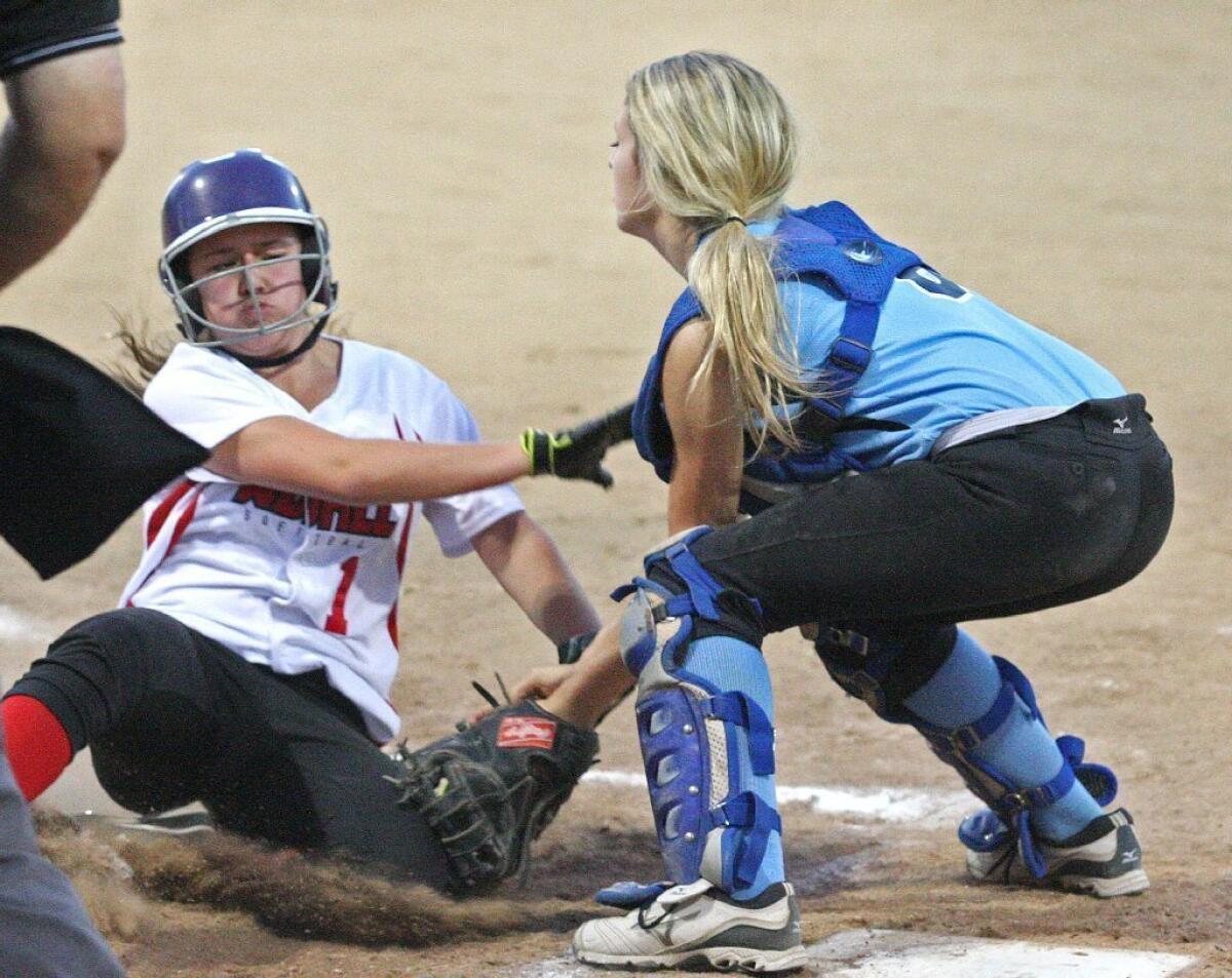 Crescenta Valley-Foothill catcher Camie Ellingford tags out a Westchester Del Rey runner at home in a 12-0 loss.