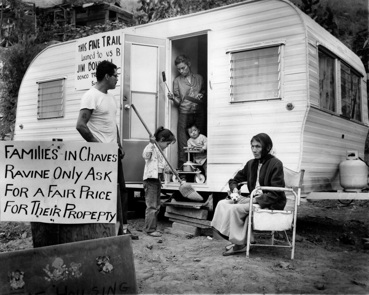 May 1959: A family, including two young children, in and in front of a trailer in Chavez Ravine