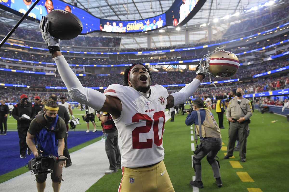 San Francisco 49ers cornerback Ambry Thomas (20) celebrates after catching an interception in overtime of an NFL football game against the Los Angeles Rams Sunday, Jan. 9, 2022, in Inglewood, Calif. The 49ers won 27-24. (AP Photo/Mark J. Terrill)