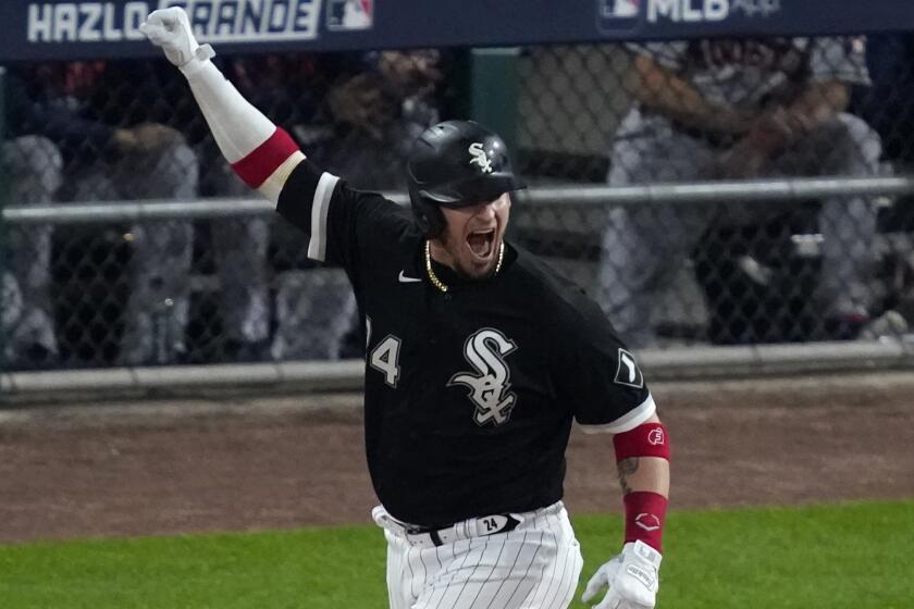 Chicago White Sox's Yasmani Grandal reacts to hitting a solo home run.