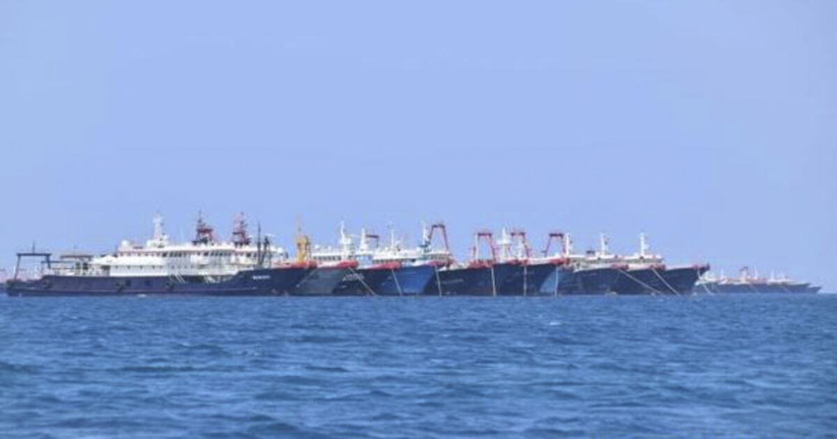 Chinese boats are lined up in the South China Sea.
