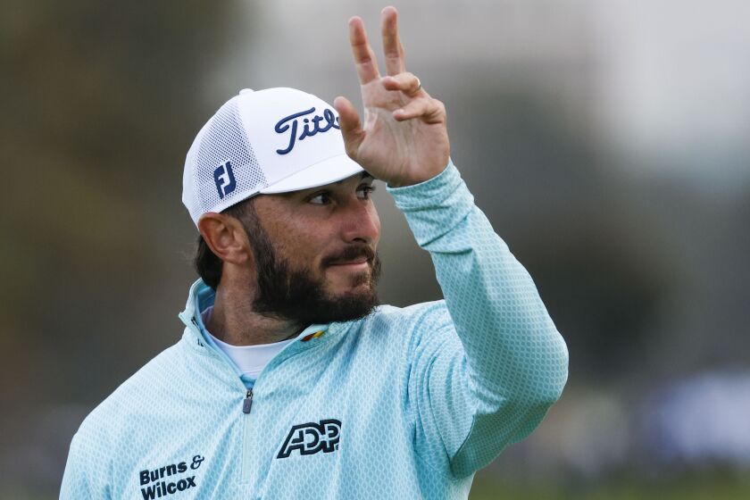 La Jolla, CA - January 28: Max Homa acknowledges the crowd after putting on the green.