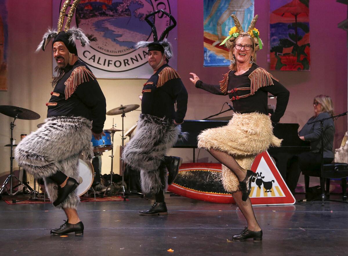 Cast members Marc Marger, far left, and Martha Davis, right, rehearse "Bye Bye Goat Heard" in Lagunatics.