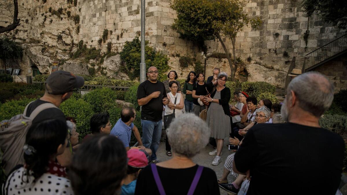Anwar Ben Badis leads a Ramadan tour at the Old City in Jerusalem.