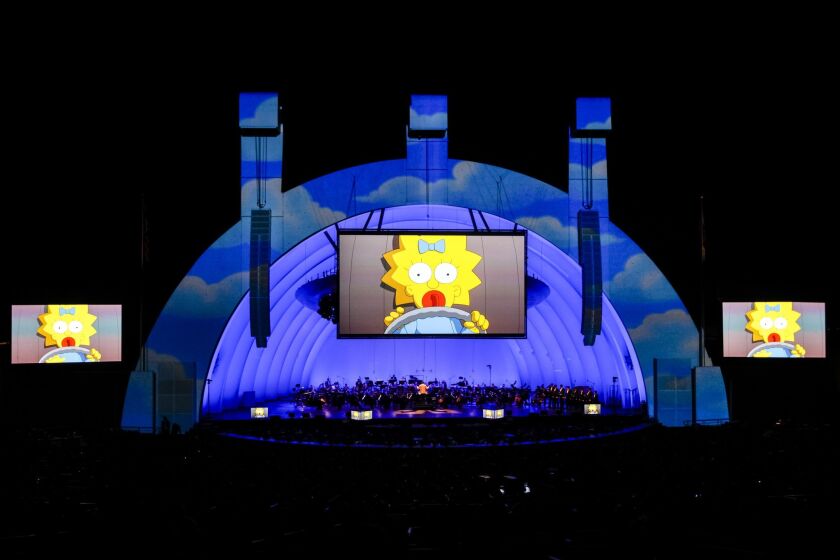 Maggie owns the screen at the Hollywood Bowl, where "The Simpsons Take the Bowl" concert featured music and voices from 25 years of the animated series.