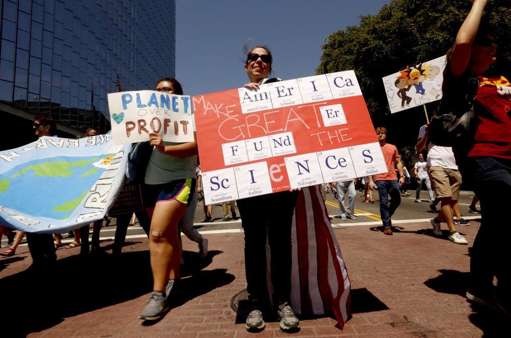 Sandy Zaic presents an elemental suggestion during the L.A. March for Science.