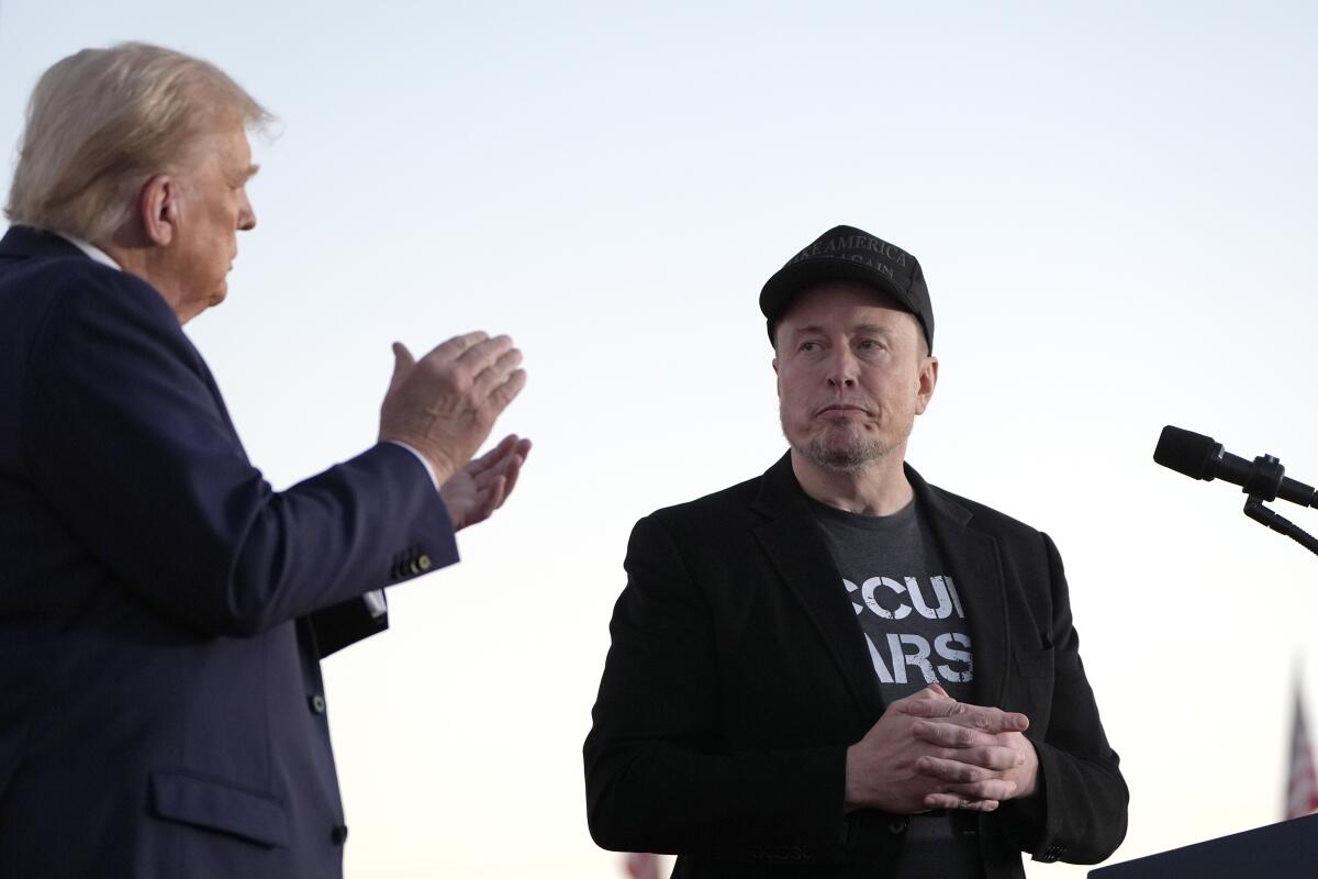 President Trump and Elon Musk stood near the podium.