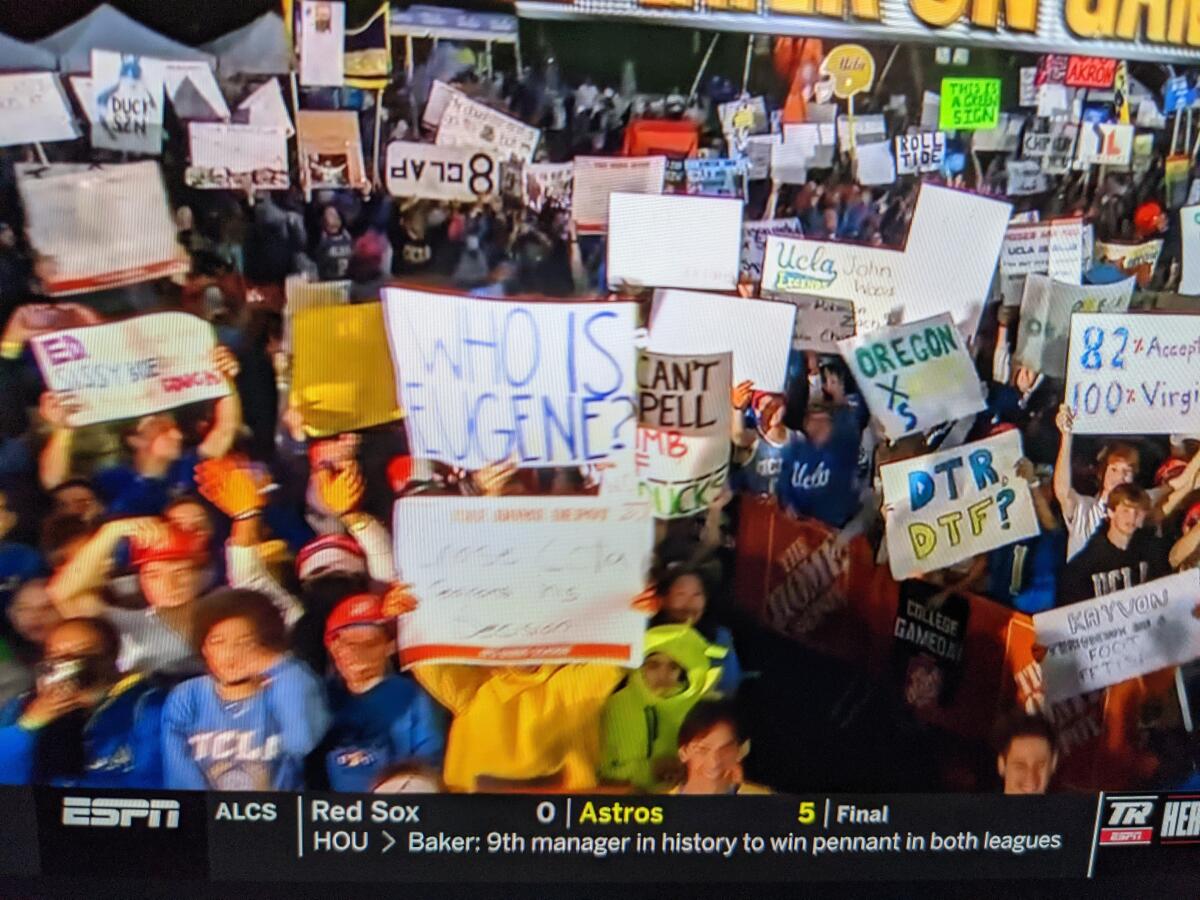 UCLA fans hold up signs during ESPN CollegeDay on Saturday.