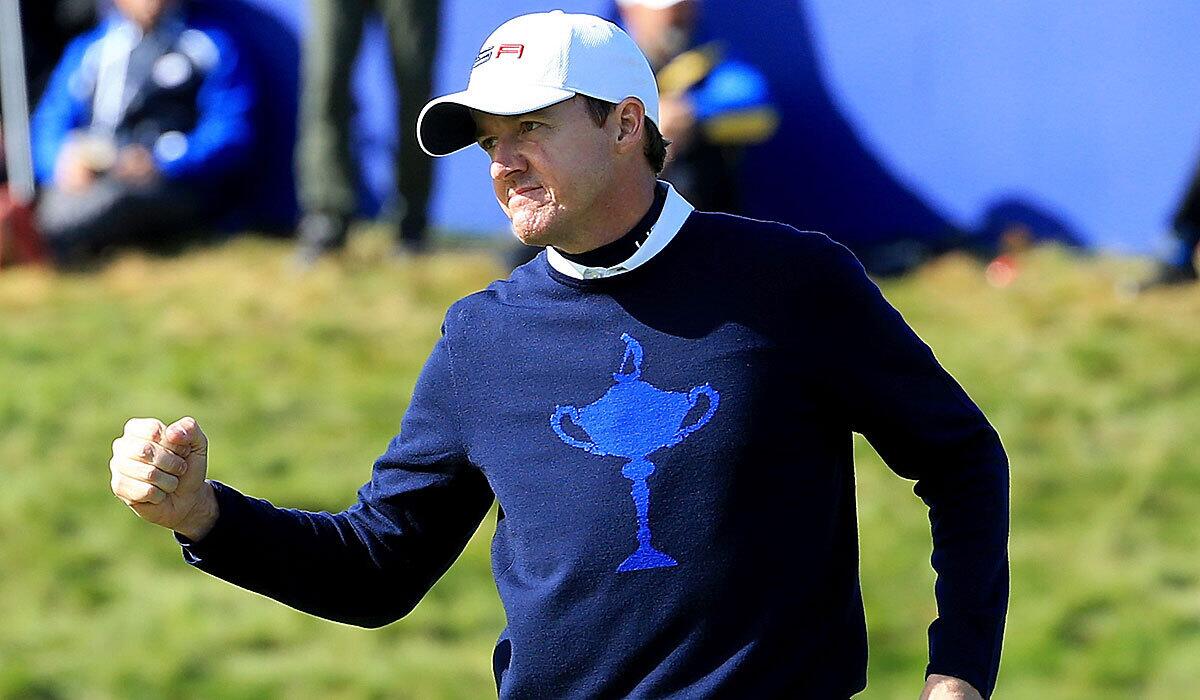Jimmy Walker of the United States celebrates halving his match during the morning fourballs Friday at the 2014 Ryder Cup in Gleneagles, Scotland.