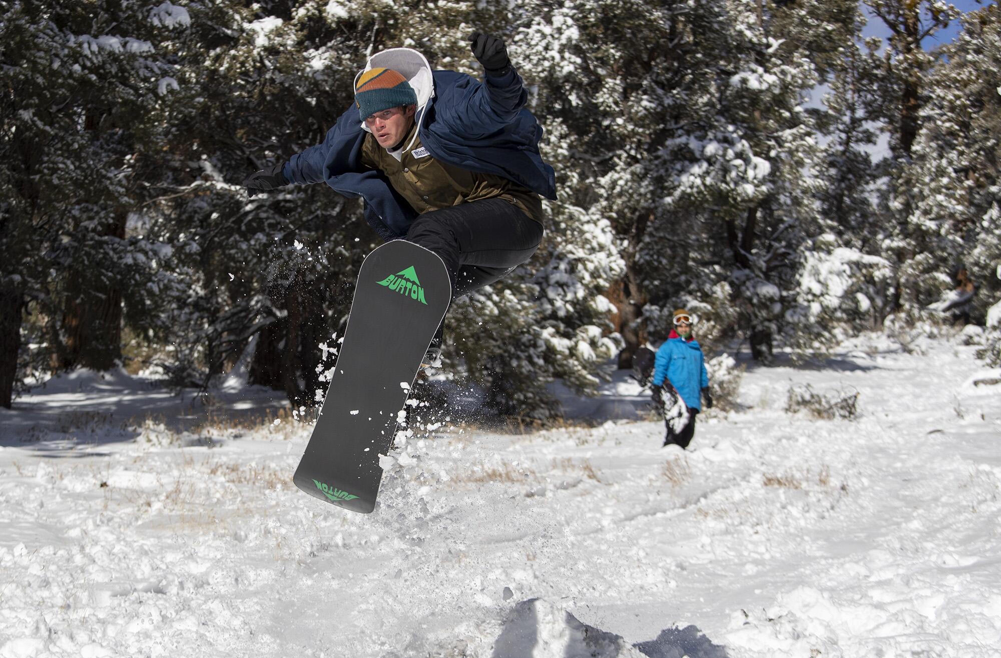 Dorian Ashmore backcountry snowboards with a friend in some fresh snow near Big Bear Lake.