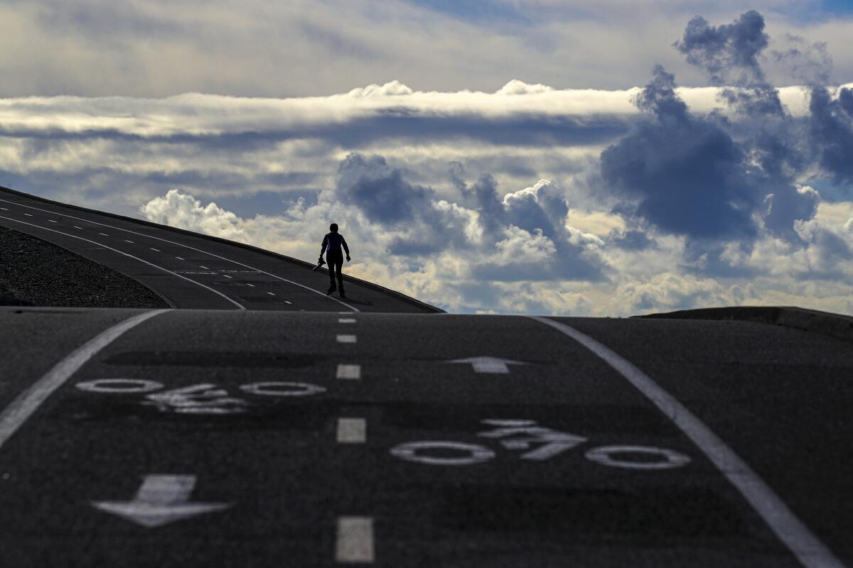 A rollerblader uses the San Gabriel River Trail near Santa Fe Dam in Irwindale on March 4. 