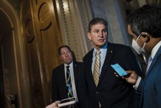 WASHINGTON, DC - FEBRUARY 17: Sen. Joe Manchin (D-WV) stops to chat with reporters outside the Senate Chamber on Capitol Hill on Thursday, Feb. 17, 2022 in Washington, DC. (Kent Nishimura / Los Angeles Times)