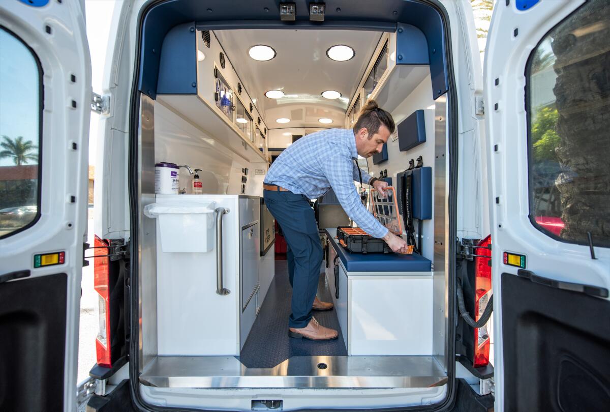 Physician assistant Robert Horner inside a mobile unit of CalOptima's Street Medicine program, servicing Garden Grove.