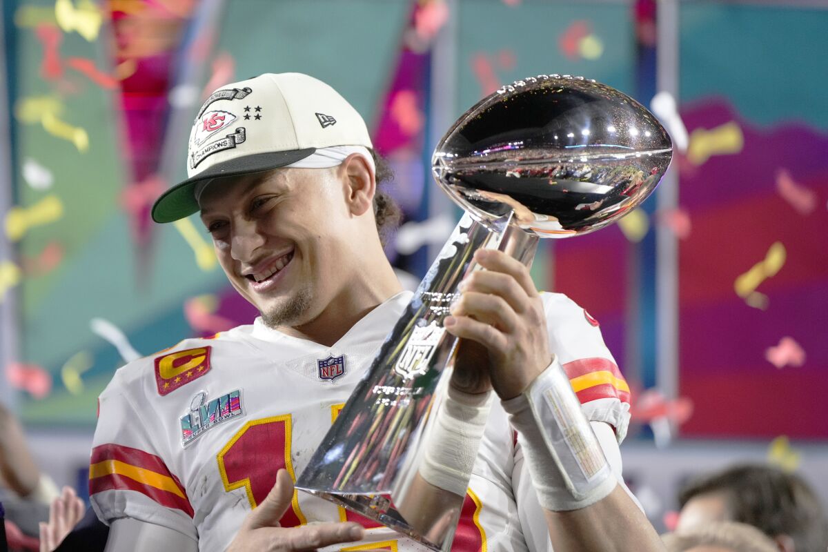Chiefs quarterback Patrick Mahomes holds the Vince Lombardi Trophy after leading Kansas City to a 38-35 comeback win.