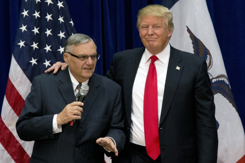 Joe Arpaio, then a controversial Arizona sheriff and an early supporter of Donald Trump's campaign, appears with him in January 2016 in Marshalltown, Iowa. Trump pardoned Arpaio the following August.
