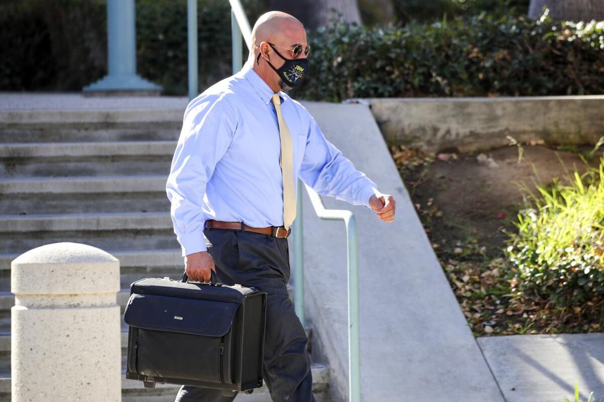 John Olivas exits the federal courthouse in Riverside.