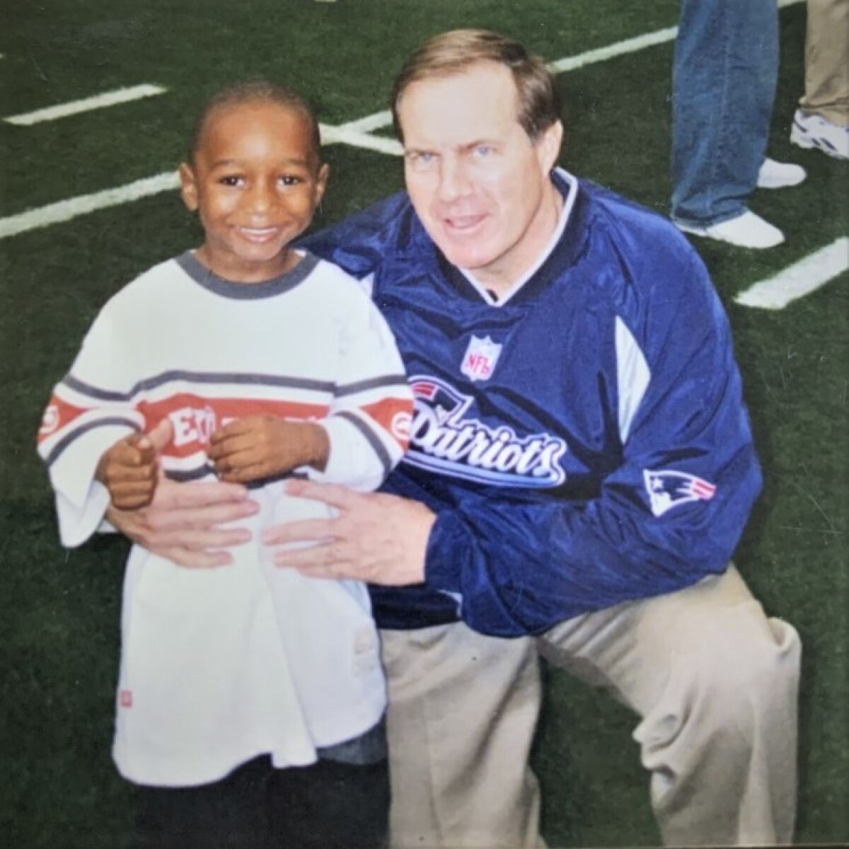 Asante Samuel Jr. with New England coach Bill Belichik when Asante Sr. was a member of the Patriots.