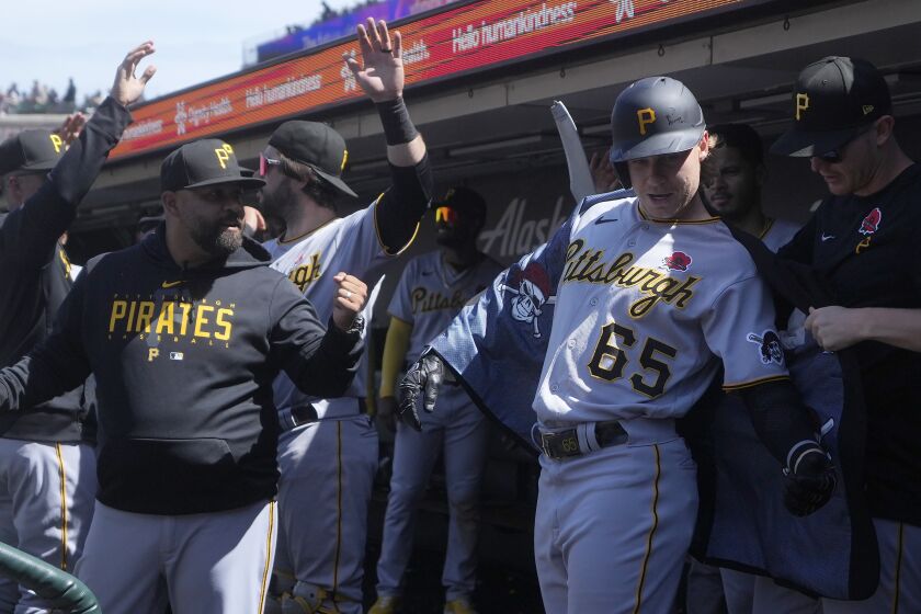 Pittsburgh Pirates' Jack Suwinski (65) celebrates with teammates after hitting a home run against the San Francisco Giants during the seventh inning of a baseball game in San Francisco, Monday, May 29, 2023. (AP Photo/Jeff Chiu)