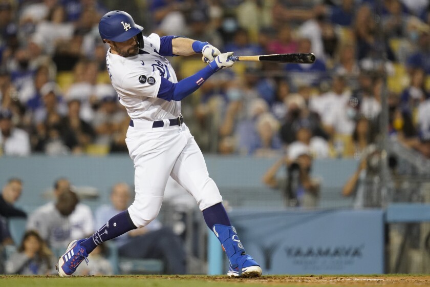 The Dodgers' AJ Pollock hits a two-run homer during the fourth inning Oct. 2, 2021.