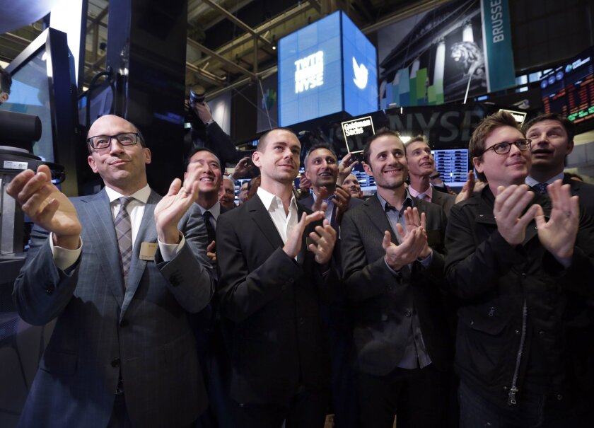 On Nov. 7, 2013, Twitter Chief Executive Dick Costolo, front row from left, Chairman and cofounder Jack Dorsey and cofounders Evan Williams and Biz Stone, applaud as they watch the ringing of the opening bell at the New York Stock Exchange. Twitter is one of many Silicon Valley companies that have released their ethnic and gender diversity data.