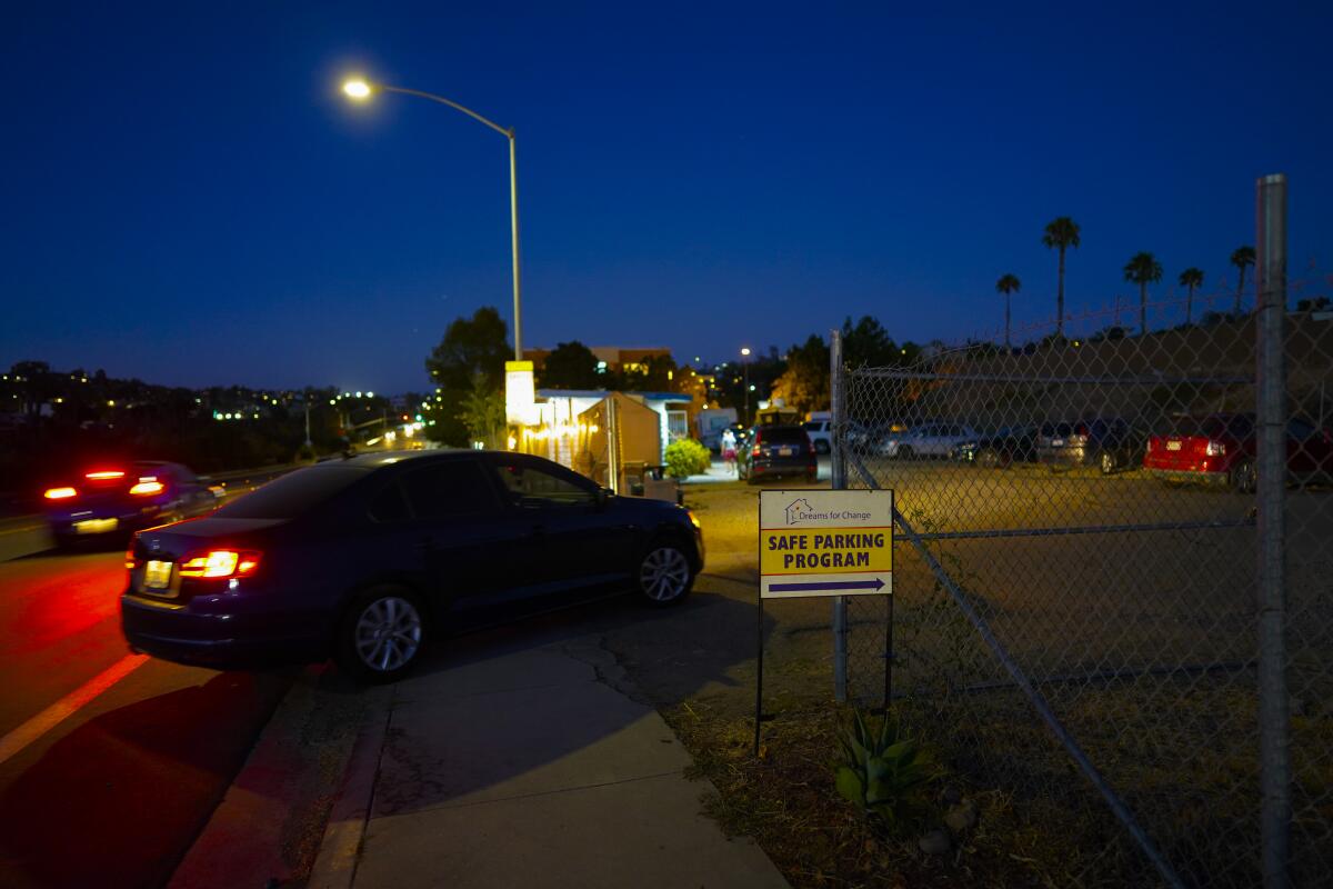 A car pulls into the safe parking lot operated by Dreams for Change in Encanto.
