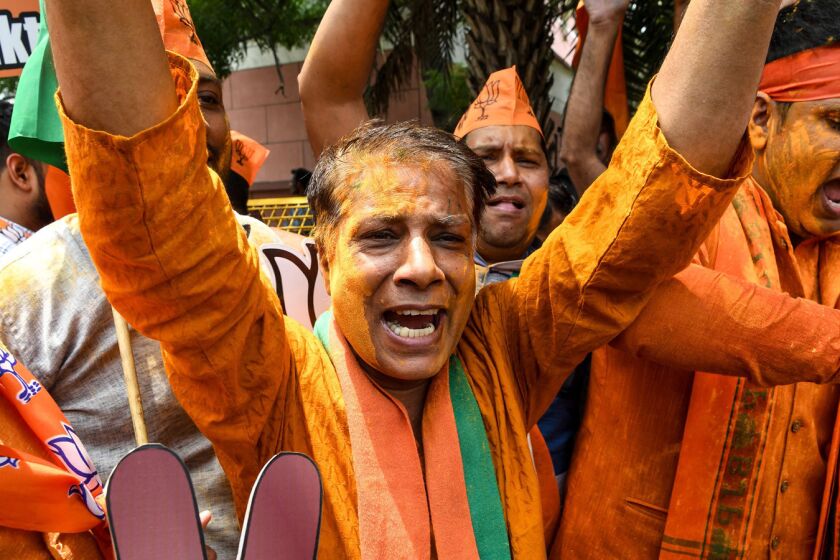 Indian Bharatiya Janata Party (BJP) supporters shout slogans as they celebrate on the vote results day for India's general election at BJP headquarters in New Delhi on May 23, 2019. - Prime Minister Narendra Modi looked on course on May 23 for a major victory in India's election, with early trends from the election commission showing a clear lead for his party. (Photo by Sajjad HUSSAIN / AFP)SAJJAD HUSSAIN/AFP/Getty Images ** OUTS - ELSENT, FPG, CM - OUTS * NM, PH, VA if sourced by CT, LA or MoD **