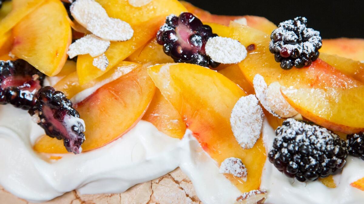 Popular British-Israeli chef Yotam Ottolenghi visits The Times' Test Kitchen with his recipe developer to make a fruit pavlova (meringue and cream dessert) from their new cookbook.