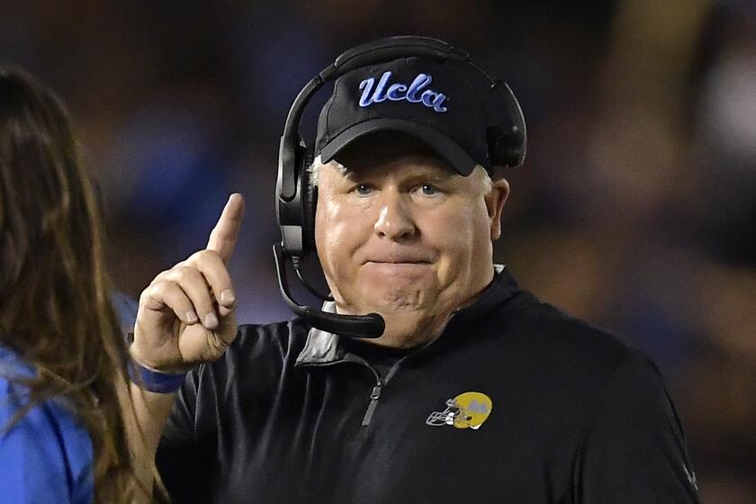 FILE - In this Oct. 20, 2018 file photo UCLA head coach Chip Kelly gestures during the first half.