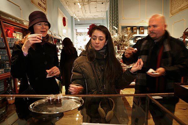 A New Cuisine Soho tour called Sweet Walks is lead by Linzi Jean Fastiggi, center. One of the many stops is at MarieBelle Sweets on Broome Street in Soho, where Vicki Hughes, left, and Hunter Hughes, of Orlando, Fla., sample the hot chocolate. The Hugheses are on their honeymoon.