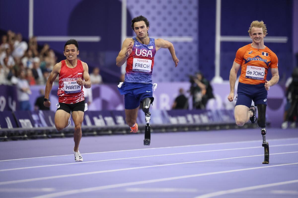 Ezra Frech runs in the men's 100-meter T63 event at the Paris Paralympics on Monday.