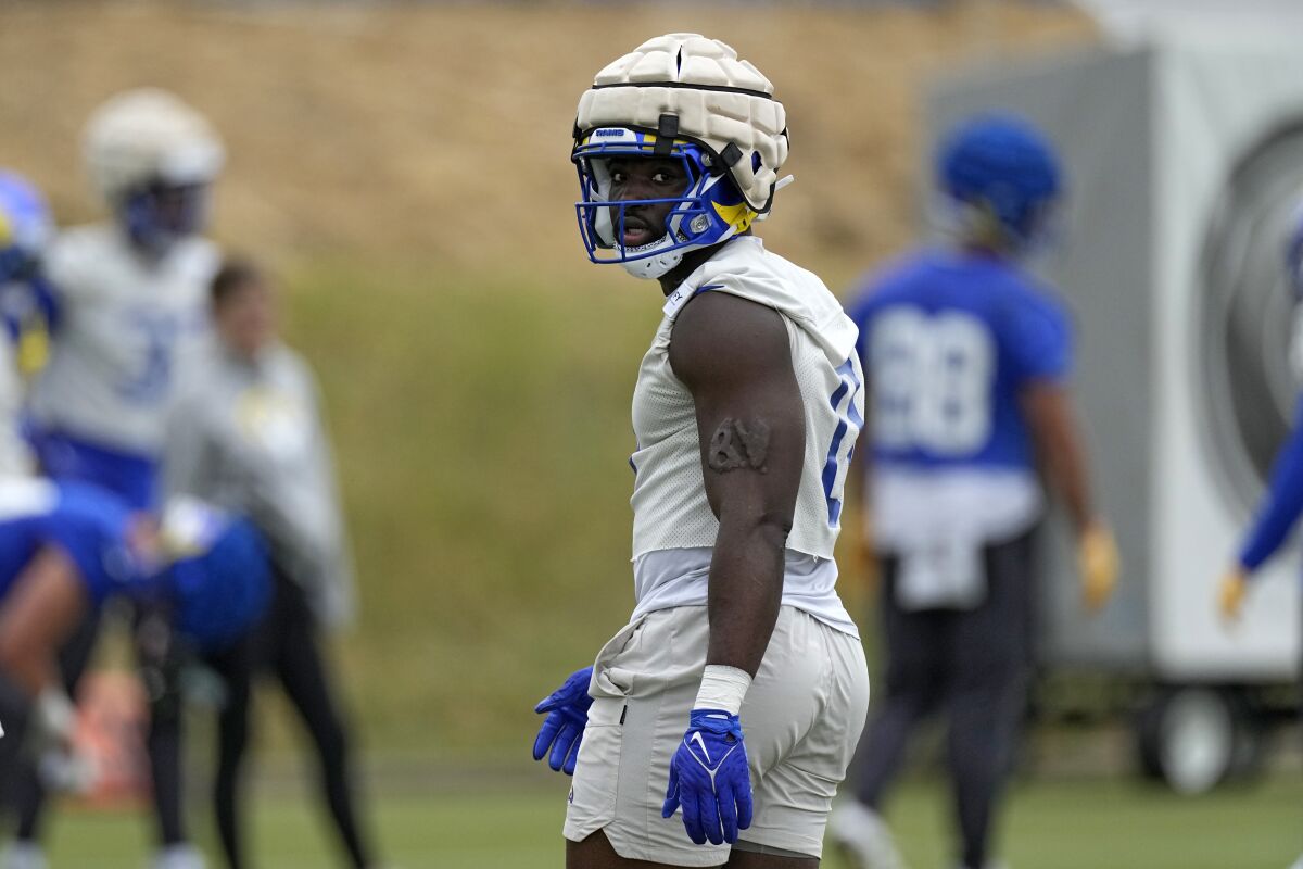 Rams linebacker Byron Young stands on the field during the team's organized activities.