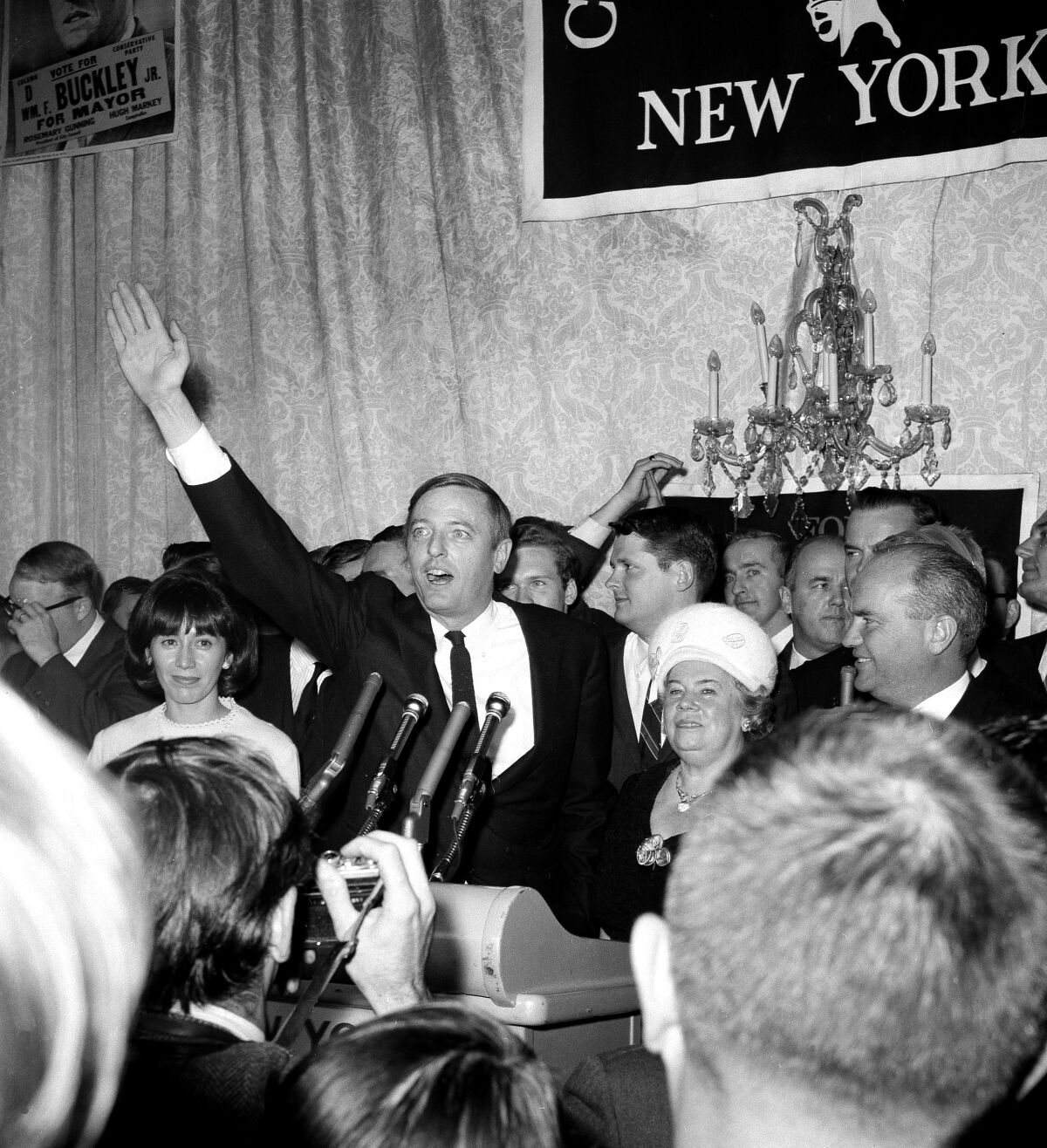 William F. Buckley Jr. waves to the crowd at his mayoral campaign concession speech