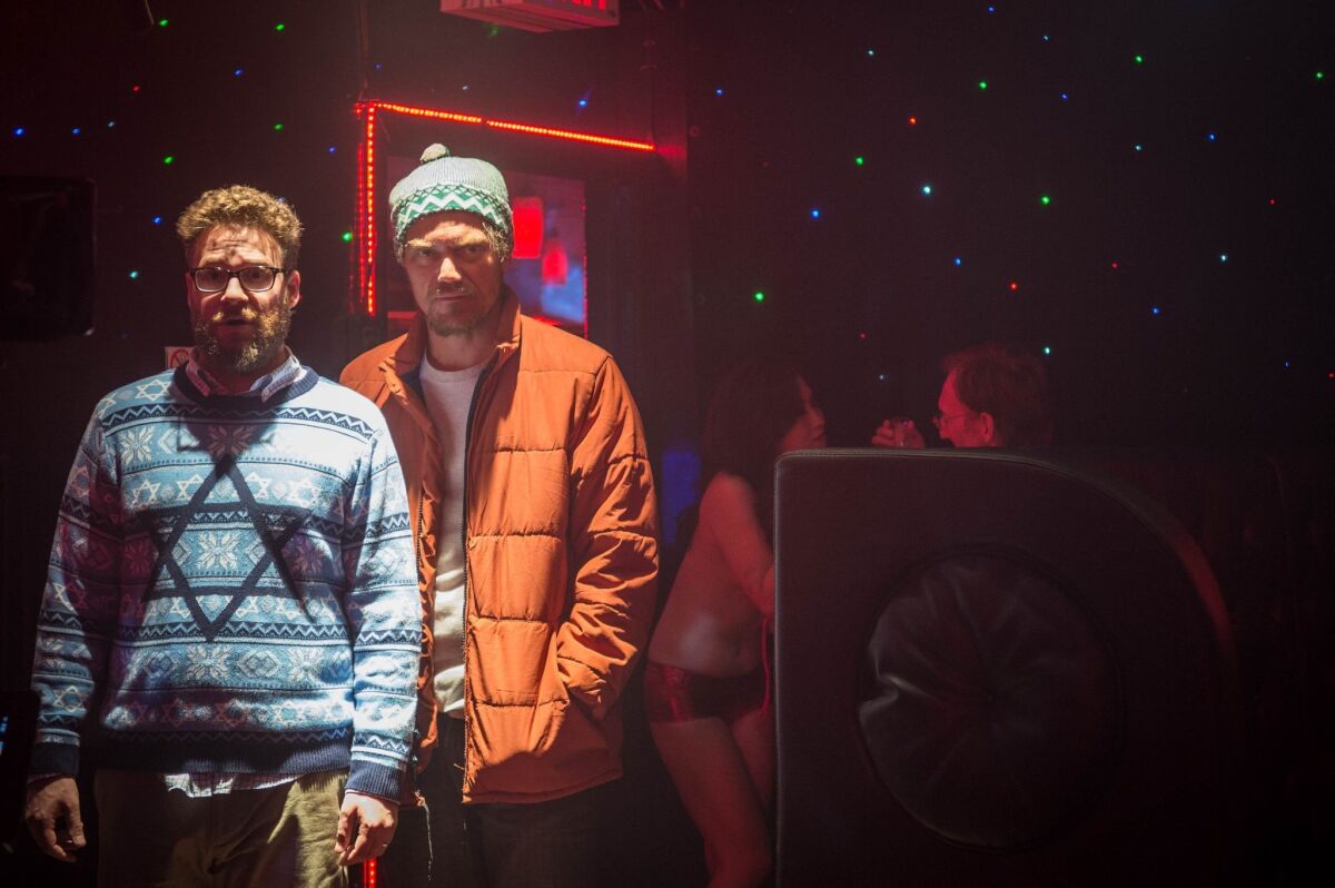 Seth Rogen, left, and Michael Shannon in "The Night Before."