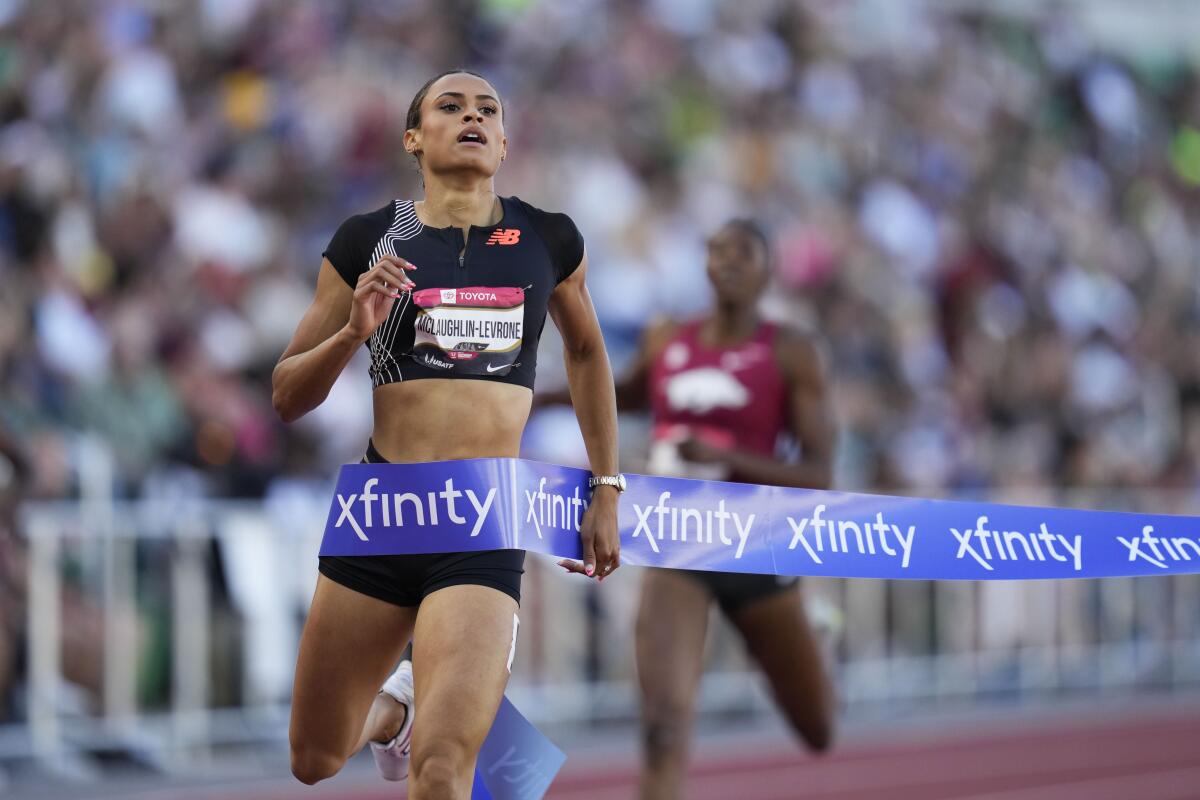 Sydney McLaughlin-Levrone crosses the finish line to win the women's 400 meters at the U.S. track and field championships.