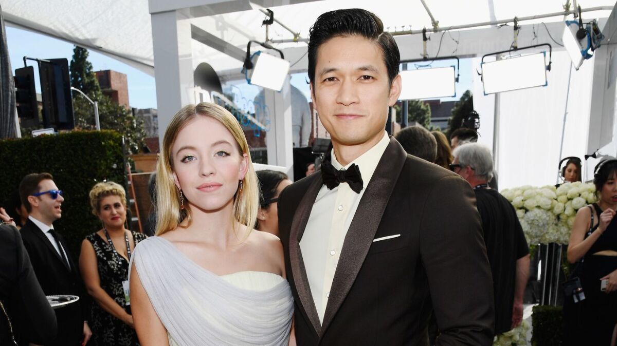 Sydney Sweeney, left, and Harry Shum Jr. at the 25th Screen Actors Guild Awards at the Shrine Auditorium on Sunday in Los Angeles.