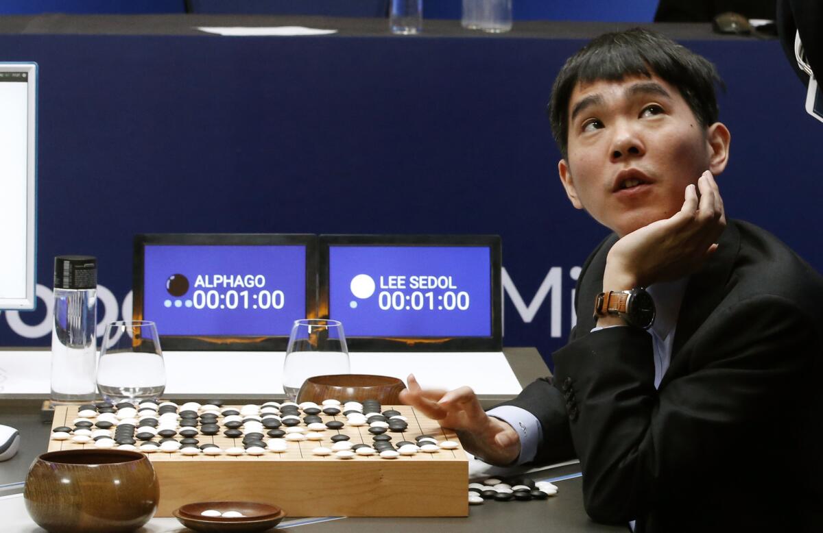 South Korean Go master Lee Sedol at the board after losing his second match to the Google DeepMind artificial intelligence program AlphaGo in Seoul.