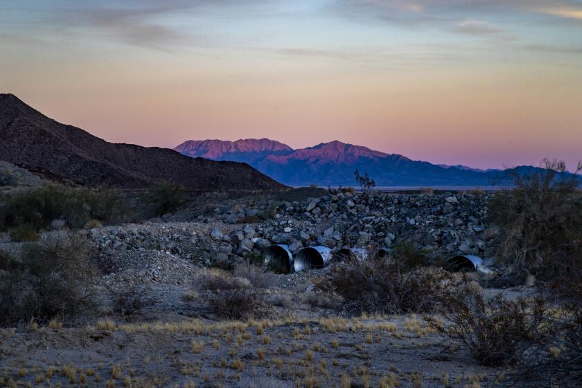 DESERT CENTER, CA - DECEMBER 16, 2020: Dusk settles in over water culverts across from the rural Eagle Mountain Pumping Plant, MWD off Kaiser truck Road on December 16, 2020 in Desert Center, California. Several women have come forward to say they have endured years of sexual harassment and discrimination and the MWD has done little to help.(Gina Ferazzi / Los Angeles Times)