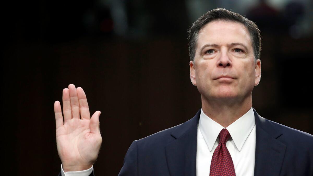 Former FBI director James B. Comey is sworn in during a June 8 Senate Intelligence Committee hearing on Capitol Hill.