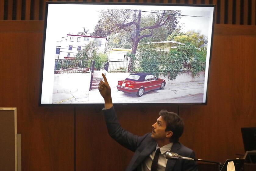 LOS ANGELES, CA - MAY 29, 2019 - - Ashton Kutcher points to a drawing of stabbing victim Ashley Ellen's residents while giving testimonial at the trial of Michael Gargiulo at Clara Shortridge Foltz Criminal Justice Center in Los Angeles on May 29, 2019. Gargiulo, is charged in the stabbing deaths of two women, including a woman who was set to go to a Grammy Awards party with actor Ashton Kutcher. (Genaro Molina/Los Angeles Times)
