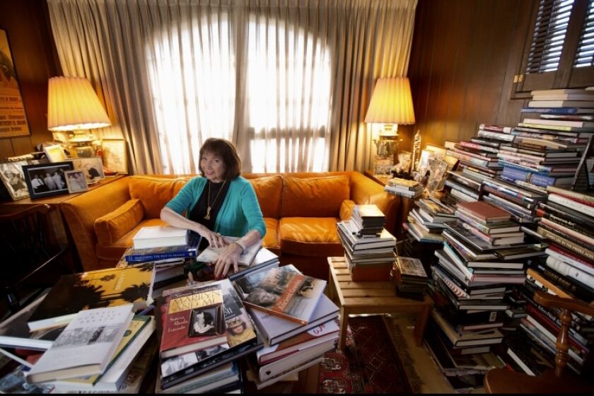 Connie Martinson with her trove of books. *** This is ONE TIME usage for obit - do not republish **