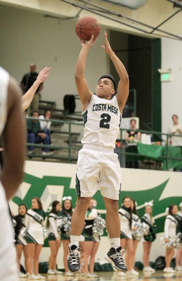 Costa Mesa High's Daniel Azurin (2) attempts a three-pointer during the first half against Harvard-Westlake in a CIF-Southern Section Division 4AA first-round game on Wednesday.