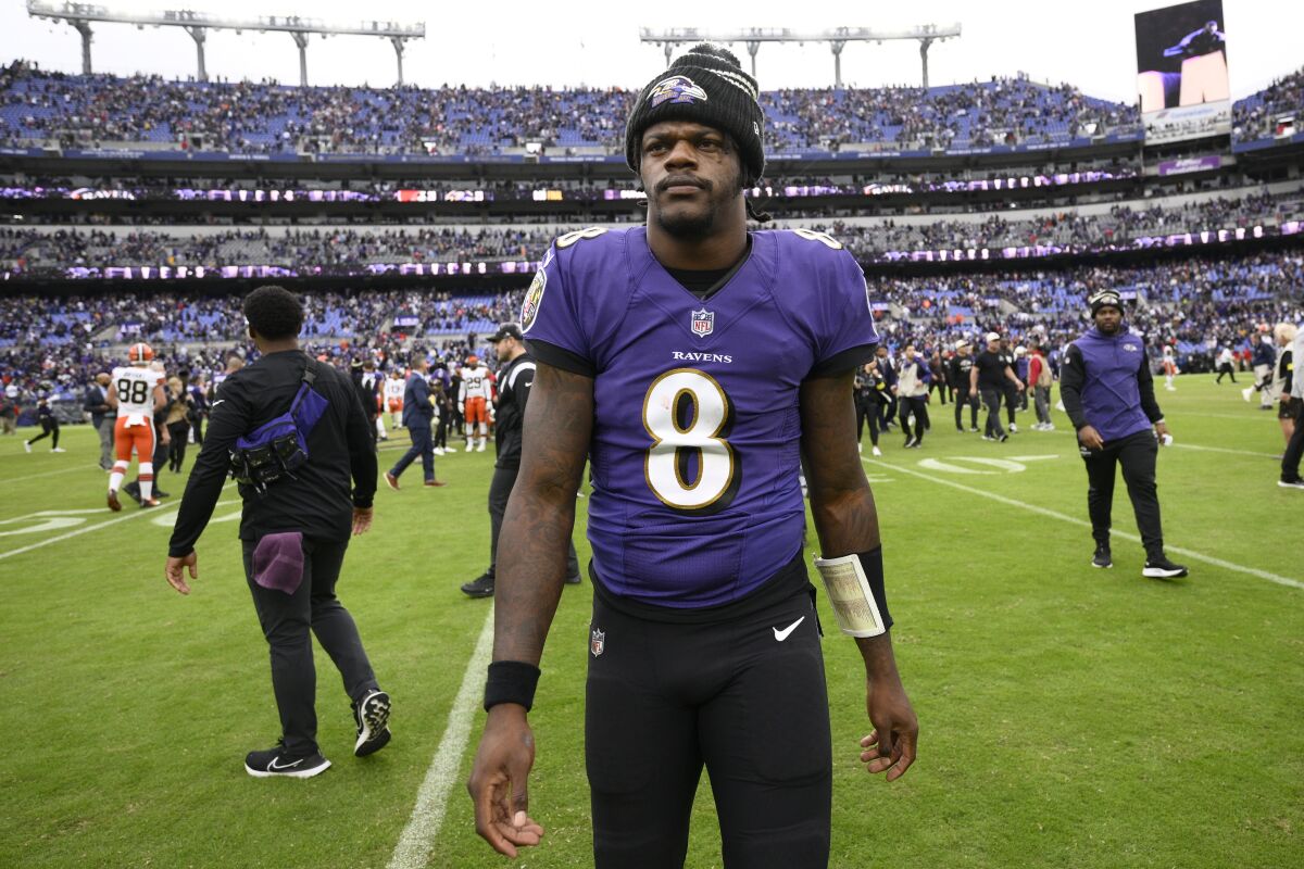 FILE - Baltimore Ravens quarterback Lamar Jackson (8) walks on the field after an NFL football game against the Cleveland Browns, Sunday, Oct. 23, 2022, in Baltimore. Lamar Jackson said Monday, March 27, 2023, he has requested a trade from the Ravens. (AP Photo/Nick Wass, File)
