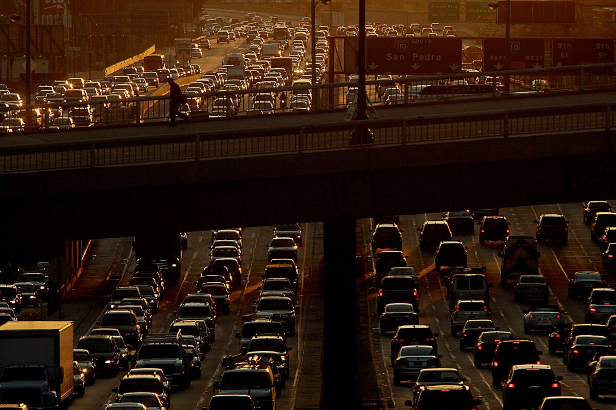 Traffic jams the 110 Freeway as drivers make their weekend getaways five days before Christmas in 2013.