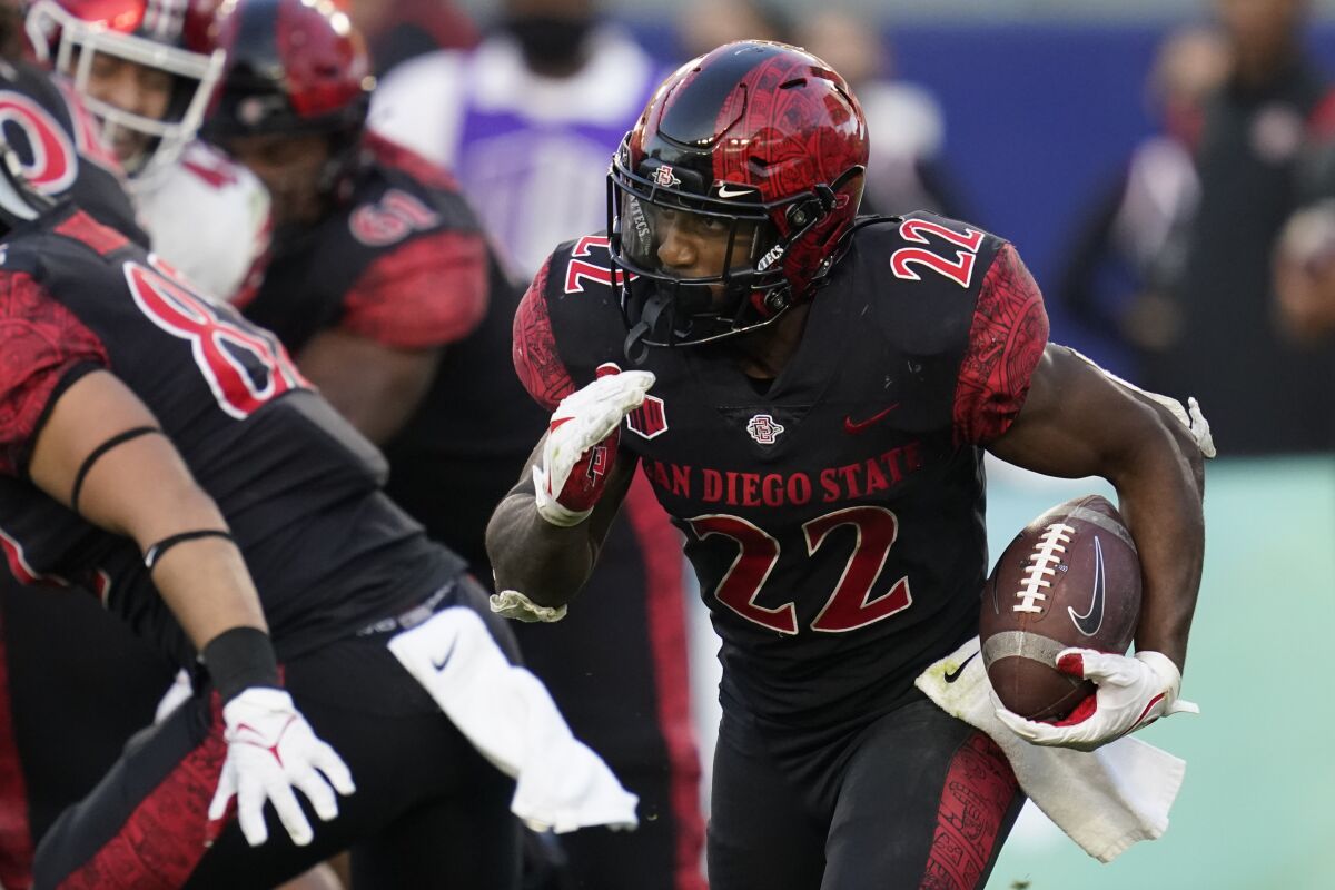 San Diego State running back Greg Bell (22) runs the ball during the second half of an NCAA college football game against Utah Saturday, Sept. 18, 2021, in Carson, Calif. (AP Photo/Ashley Landis)