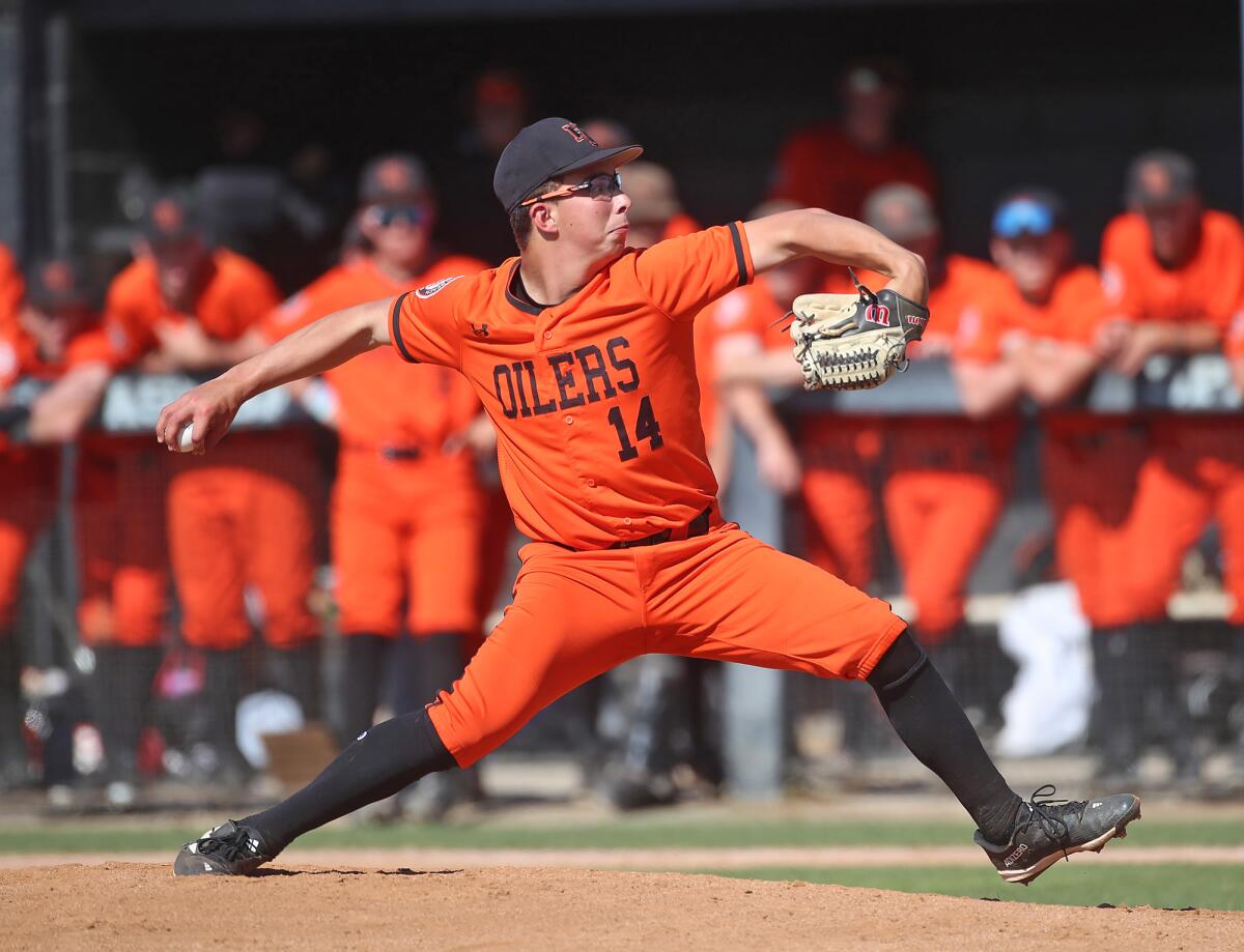 Starting pitcher Tyler Bellerose (14) of Huntington Beach delivers a pitch at Villa Park on Tuesday.