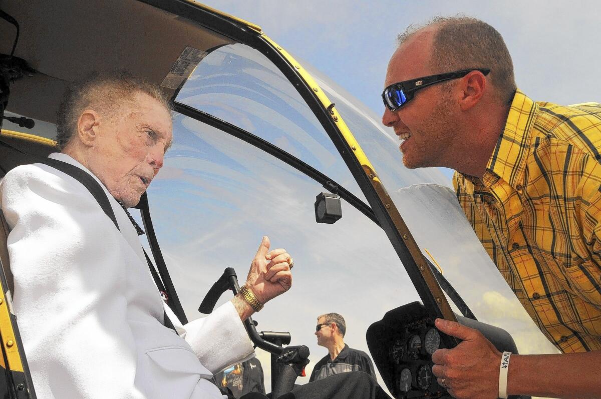 Former U.S. Rep. Kenneth J. Gray, pictured in 2013 at 88, talks to his grandson, Josh Joiner, before taking off in a helicopter ride at Black Diamond Harley-Davidson in Marion, Ill. Gray has died at 89.
