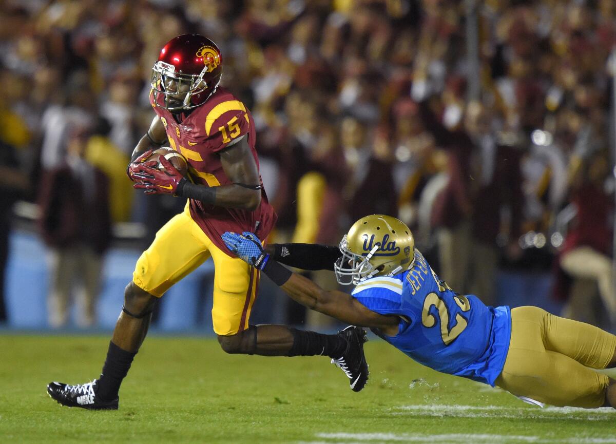 USC receiver Nelson Agholor escapes a tackle from UCLA defensive back Anthony Jefferson during the first half of the Trojans' 38-20 loss to the Bruins on Nov. 22.