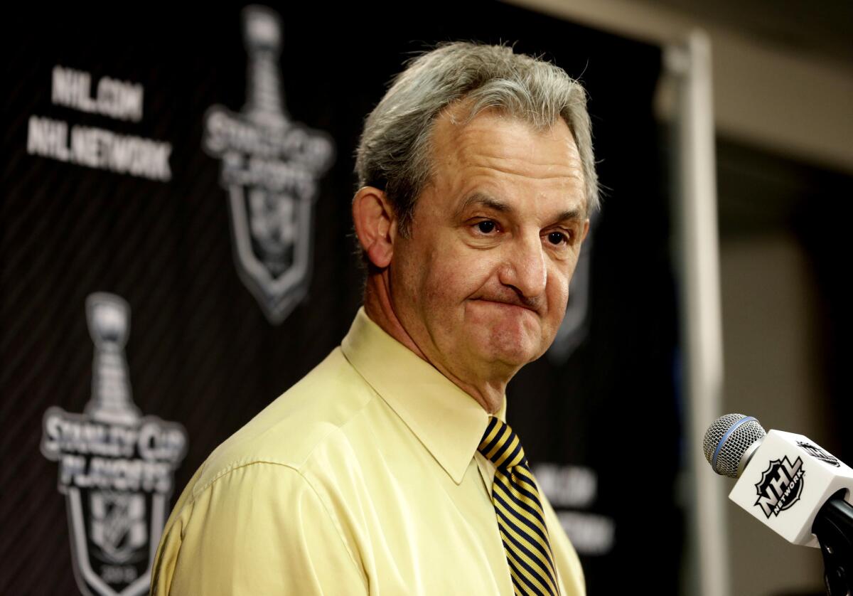 Kings head coach Darryl Sutter talks to reporters after the Chicago Blackhawks' 4-3 win over the Kings.